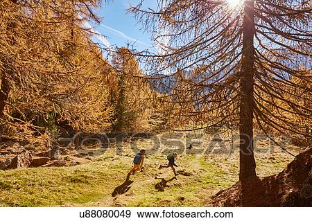 Two brothers running outdoors, Schnalstal, South Tyrol, Italy View Large Photo Image Stock Photo - Two brothers running outdoors, Schnalstal, South Tyrol, Italy. Fotosearch