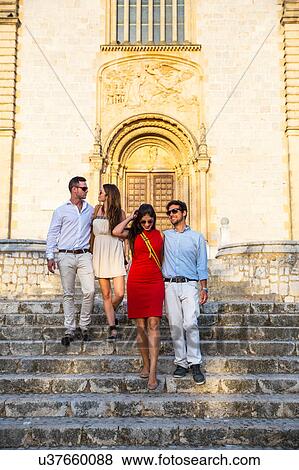Two tourist couples on church stairway, Calvia, Majorca, Spain View Large Photo Image Stock Photo - Two tourist couples on church stairway, Calvia, Majorca, Spain. Fotosearch