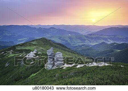 Stock Image - Ukraine, Ivano-Frankivsk region, Verkhovyna district, Carpathians, Chernohora, Mountain landscape at sunset. Fotosearch
