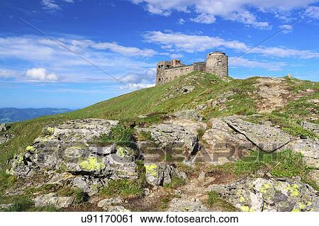 Stock Image - Ukraine, Ivano-Frankivsk region, Verkhovyna district, Carpathians, Chernohora, Stone observatory on top of hill. Fotosearch