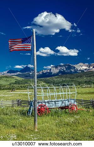 US Flag and covered wagon, Hastings Mesa, near Ridgway, Colorado View Large Photo Image Stock Photo - US Flag and covered wagon, Hastings Mesa, near Ridgway, Colorado. Fotosearch