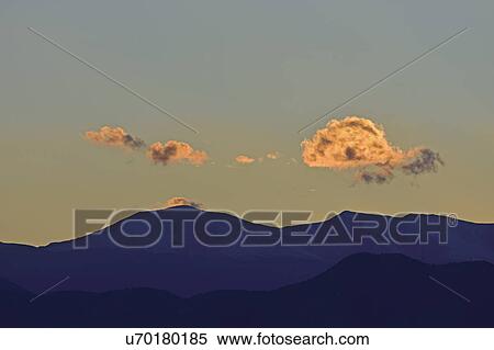 Stock Photography - USA, Colorado, Denver, Mountain landscape at sunset. Fotosearch