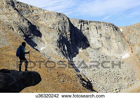 USA, Colorado, Silhouette of hiker on rock ledge along Chicago Lakes Trail in Mount Evans Wilderness Area View Large Photo Image Stock Image - USA, Colorado, Silhouette of hiker on rock ledge along Chicago Lakes Trail in Mount Evans Wilderness Area. Fotosearch