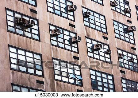 Stock Image - USA, New York, Building with air conditioners. Fotosearch