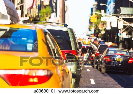 Stock Image - USA, New York, Car traffic in big city. Fotosearch