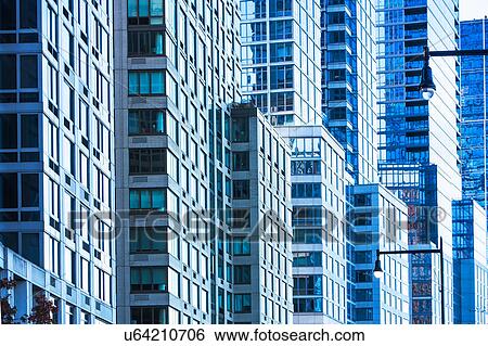 Stock Photograph - USA, New York, Glass office buildings. Fotosearch
