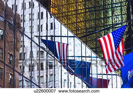 USA, New York, New York City, American flag reflection in glass facade of office building View Large Photo Image Stock Photo - USA, New York, New York City, American flag reflection in glass facade of office building. Fotosearch