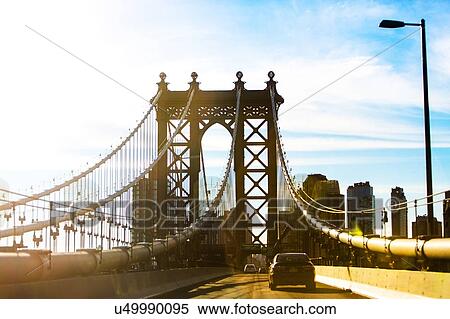 Stock Photography - USA, New York, New York City, Blue sky over Brooklyn Bridge. Fotosearch