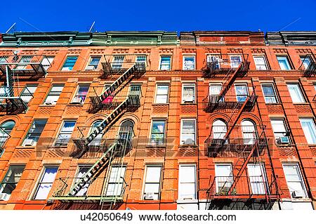 Stock Photo - USA, New York, New York City, Fire escapes of apartments. Fotosearch