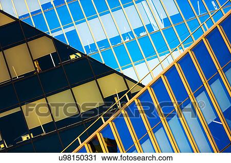 Stock Image - USA, New York, New York City, Geometric shapes of glass facade. Fotosearch