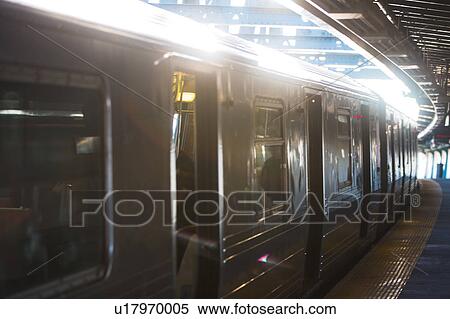 Stock Photography - USA, New York, New York City, Subway train at station. Fotosearch