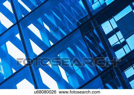 Stock Photograph - USA, New York, Reflections in Glass building. Fotosearch