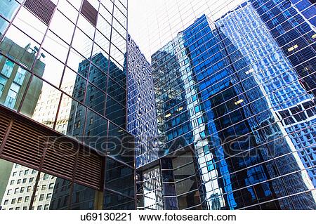 Stock Image - USA, New York, Reflections in office buildings. Fotosearch