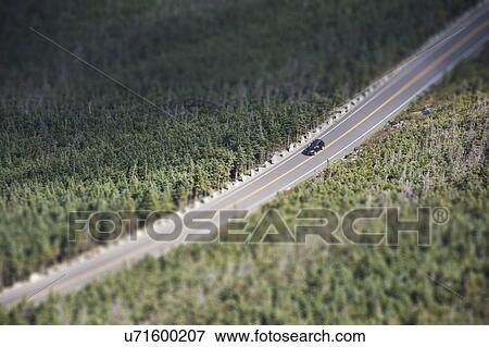 USA, New York, Wilmington, Car driving on road through forest View Large Photo Image Stock Photo - USA, New York, Wilmington, Car driving on road through forest. Fotosearch
