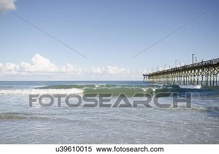 USA, North Carolina, Topsail island, Surf City, Seascape with pier View Large Photo Image Stock Photography - USA, North Carolina, Topsail island, Surf City, Seascape with pier. Fotosearch