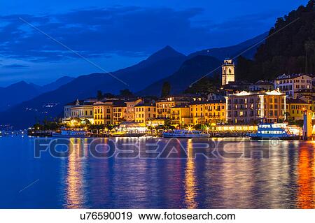 View of waterfront city lights at night, Lake Como, Italy View Large Photo Image Stock Photo - View of waterfront city lights at night, Lake Como, Italy. Fotosearch
