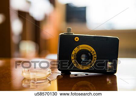 Vintage camera on table View Large Photo Image Stock Image - Vintage camera on table. Fotosearch