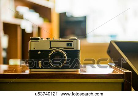 Vintage rangefinder camera on table View Large Photo Image Stock Image - Vintage rangefinder camera on table. Fotosearch