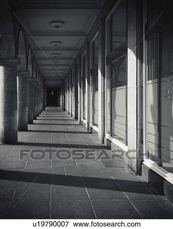 Stock Photo - Walkway with pillars and shadows. Fotosearch