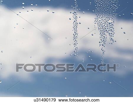 Stock Photo - Water droplets on a window pane. Fotosearch