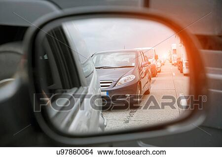 Wing mirror view of rows of traffic queueing on highway View Large Photo Image Picture - Wing mirror view of rows of traffic queueing on highway. Fotosearch