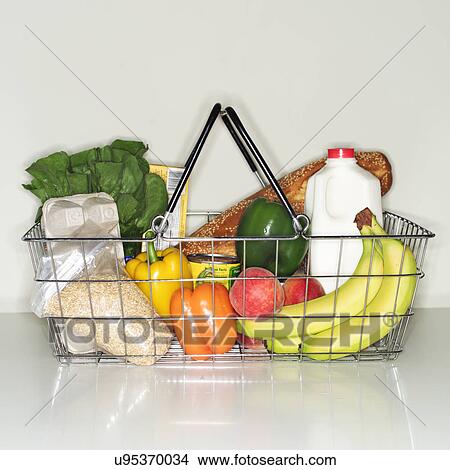 Picture - Wire basket full of groceries. Fotosearch