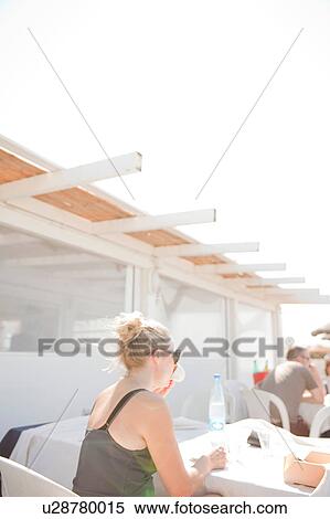Stock Photography - Woman enjoying coffee, Puglia, Italy. Fotosearch