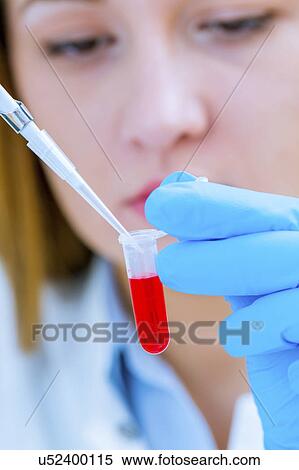 Woman holding micro tube and pipette View Large Photo Image Stock Photography - Woman holding micro tube and pipette. Fotosearch