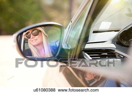 Stock Photo - Woman looking out of car window. Fotosearch