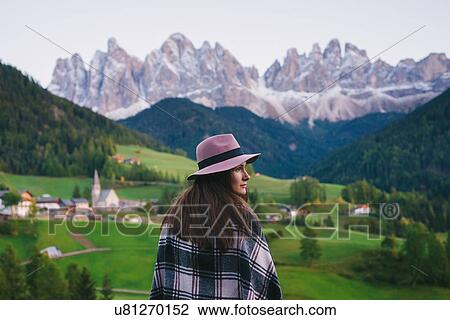 Woman looking over shoulder, Santa Maddalena, Dolomite Alps, Val di Funes (Funes Valley), South Tyrol, Italy View Large Photo Image Stock Image - Woman looking over shoulder, Santa Maddalena, Dolomite Alps, Val di Funes (Funes Valley), South Tyrol, Italy. Fotosearch