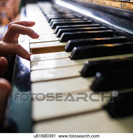 Woman playing piano, close-up View Large Photo Image Stock Image - Woman playing piano, close-up. Fotosearch