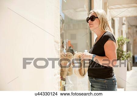 Picture - Woman shopping, Lecce, Italy. Fotosearch