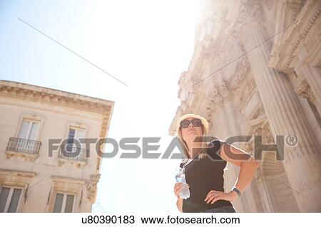 Woman standing outside Chiesa di Sant'Irene, Lecce, Italy View Large Photo Image Stock Image - Woman standing outside Chiesa di Sant'Irene, Lecce, Italy. Fotosearch