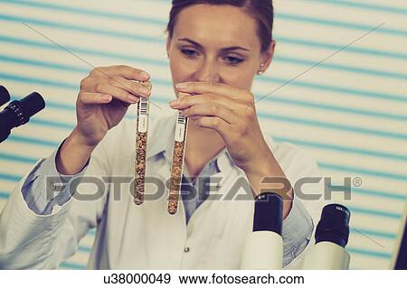 Stock Photo - Woman testing food samples. Fotosearch