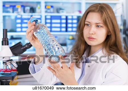 Woman testing water View Large Photo Image Stock Photo - Woman testing water. Fotosearch