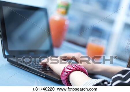 Woman using laptop View Large Photo Image Stock Image - Woman using laptop. Fotosearch