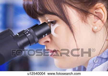 Woman using microscope View Large Photo Image Picture - Woman using microscope. Fotosearch