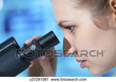 Woman using microscope View Large Photo Image Stock Image - Woman using microscope. Fotosearch