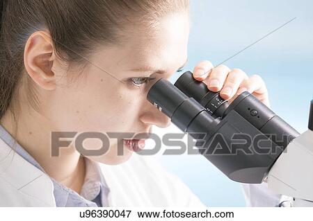 Woman using microscope View Large Photo Image Stock Photo - Woman using microscope. Fotosearch