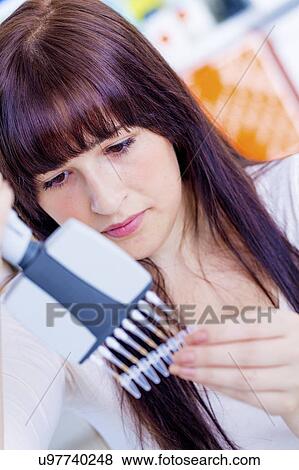 Stock Photo - Woman using multi pipette. Fotosearch