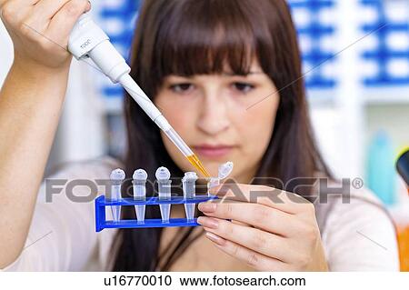 Woman using pipette View Large Photo Image Stock Image - Woman using pipette. Fotosearch