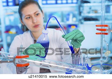 Stock Photography - Woman working in chemical laboratory. Fotosearch