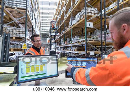 Stock Photograph - Workers in dispatch department of cable store warehouse at cable storage facility. Fotosearch