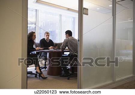 Young business people having meeting in conference room View Large Photo Image Stock Image - Young business people having meeting in conference room. Fotosearch