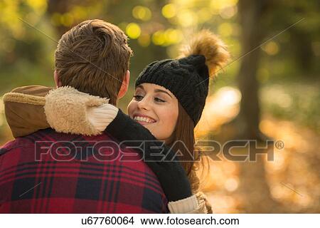 Young couple in forest, embracing View Large Photo Image Picture - Young couple in forest, embracing. Fotosearch