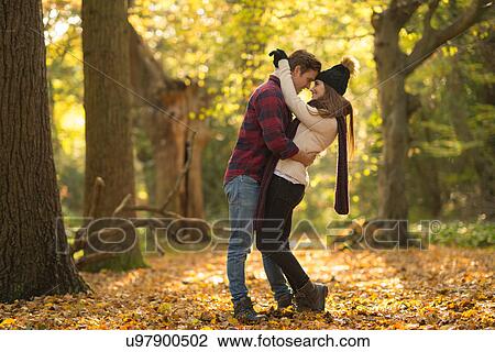 Young couple in forest, embracing View Large Photo Image Stock Image - Young couple in forest, embracing. Fotosearch