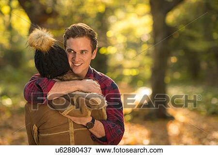 Young couple in forest, embracing View Large Photo Image Stock Photo - Young couple in forest, embracing. Fotosearch
