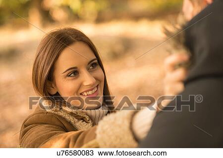 Young couple in forest, face to face, smiling View Large Photo Image Stock Image - Young couple in forest, face to face, smiling. Fotosearch