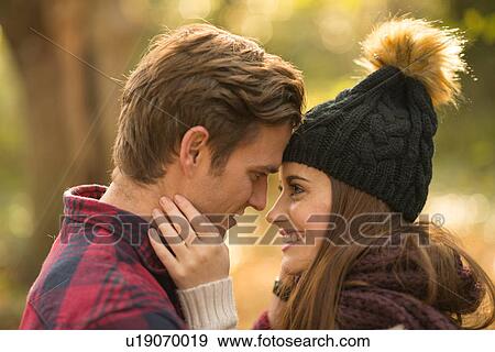 Young couple in forest, face to face, low section View Large Photo Image Stock Photo - Young couple in forest, face to face, low section. Fotosearch