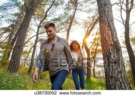 Young couple strolling in coastal forest, Split, Dalmatia, Croatia View Large Photo Image Stock Image - Young couple strolling in coastal forest, Split, Dalmatia, Croatia. Fotosearch